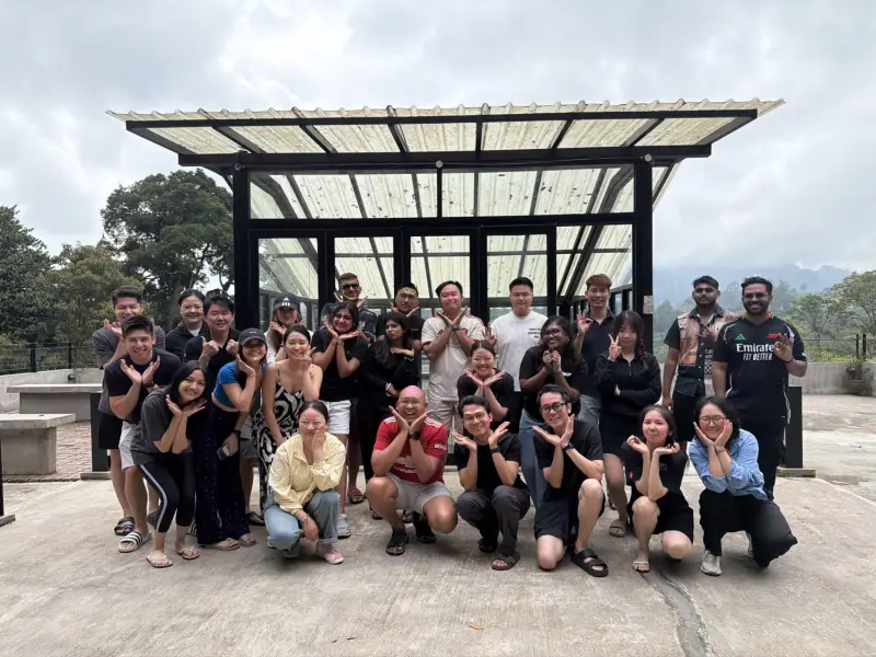 Corporate team celebrating the completion of a team-building programme